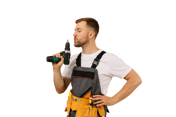 Ouvrier soufflant sur sa perceuse